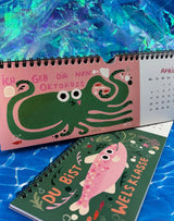 Jahreskalender 2026 mit süßen Fisch-Illustrationen und charmanten Sprüchen – der beliebte GraFische Kalender für ein lächelndes Jahr.