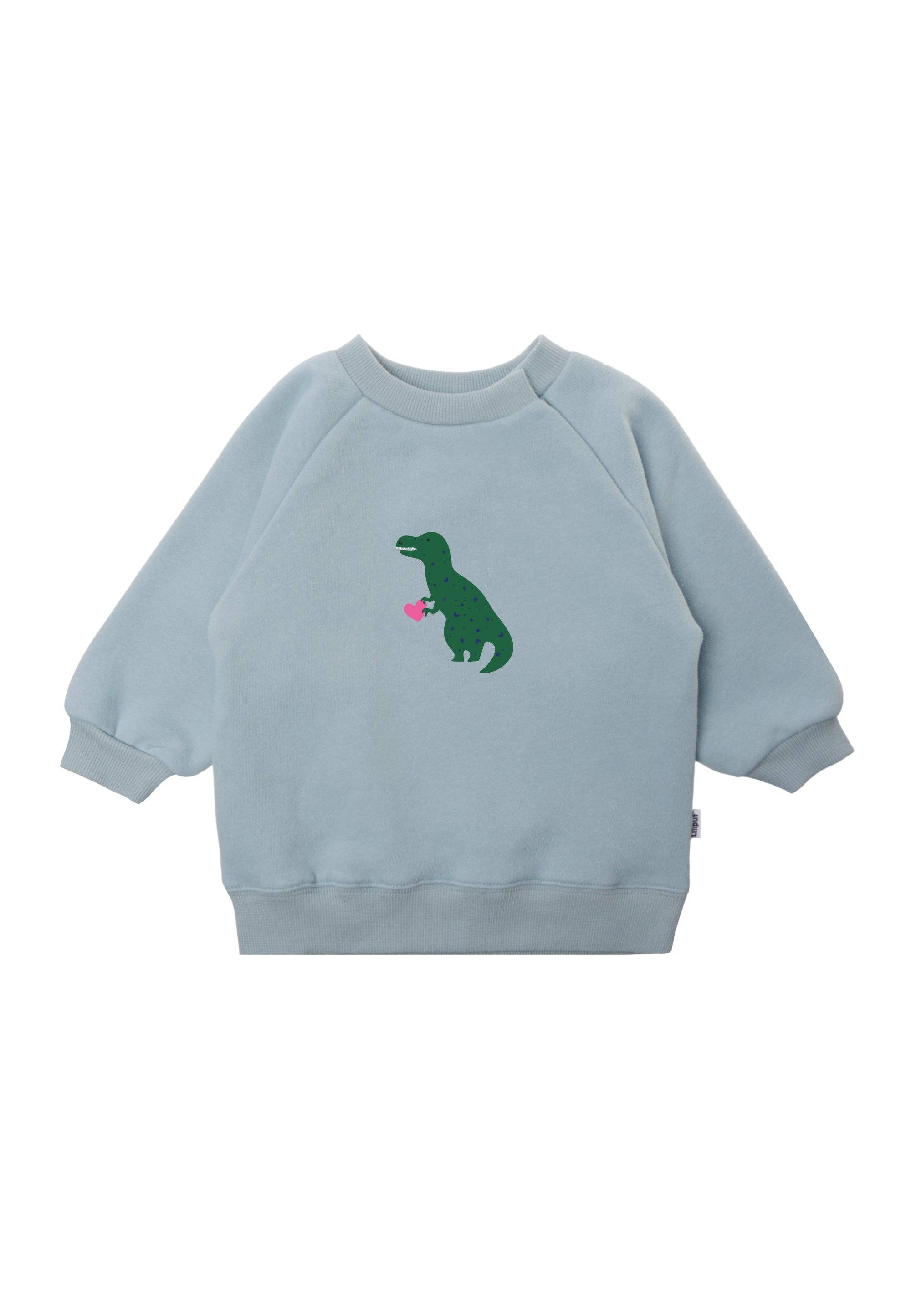 Baby Sweatshirt in Hellblau mit Dino-Print, aus 80% Baumwolle und 20% Polyester, weiche Ribbündchen an Ärmeln, praktische Druckknöpfe am Halsausschnitt.