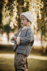 Wendejacke für Kinder aus flauschigem Teddyplüsch und weicher Baumwolle in Creme – warm, gemütlich und hautfreundlich.